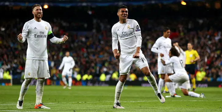 MADRID, SPAIN - APRIL 12: Sergio Ramos (L) and Casemiro of Real Madrid celebrate victory and reaching the semi finals after the UEFA Champions League quarter final second leg match between Real Madrid CF and VfL Wolfsburg at Estadio Santiago Bernabeu on April 12, 2016 in Madrid, Spain. (Photo by Alex Grimm/Bongarts/Getty Images)